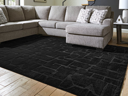 Lakeland Furniture Outlet - Ashley Furniture - Gibbswell Rug - Washable 8' x 10' Area Rug / Black - R407461